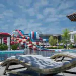 Relaxing pool area at Holidays Park Resort with water slides and sun loungers. Perfect for family fu.