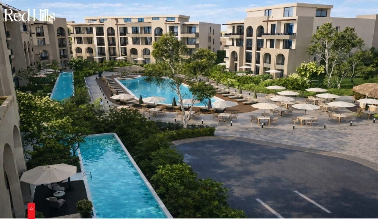 Pool area with sun loungers and umbrellas at Trivana, Hurghada.