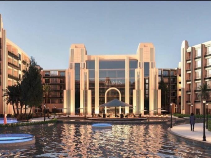 Elegant resort entrance with water fountain and lush landscaping in Hurghada.