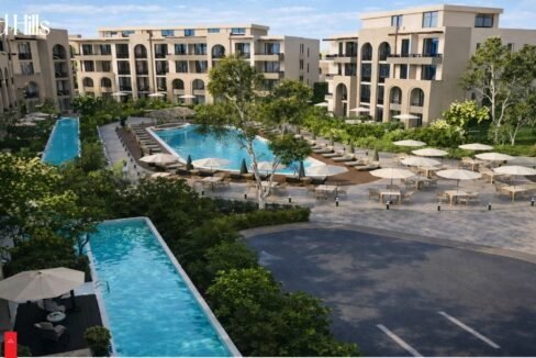 Modern pool with sun loungers and greenery at Trivana, Hurghada.