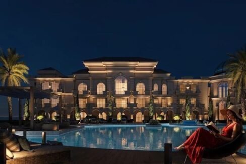 Elegant villa with illuminated pool and palm trees in Hurghada.
