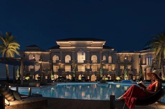 Elegant villa with illuminated pool and palm trees in Hurghada.