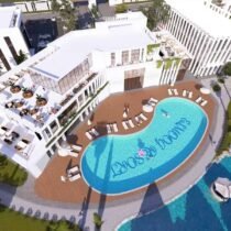Modern resort with swimming pool, sun loungers, and outdoor seating area in Hurghada.