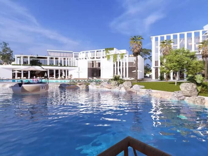 AL Mouj Resort Magawish - crystal lagoon entertainment area with turquoise water and lounge seating