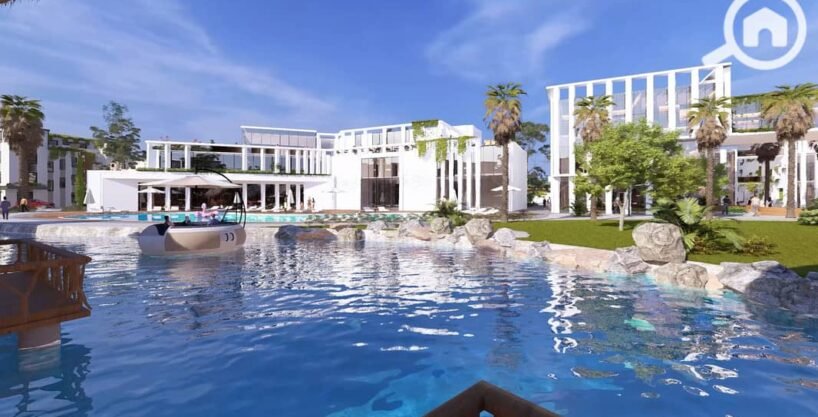 AL Mouj Resort Magawish - crystal lagoon entertainment area with turquoise water and lounge seating