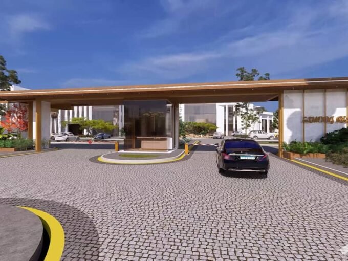 AL Mouj Resort Magawish - grand entrance gate with palm-lined driveway and security pavilion