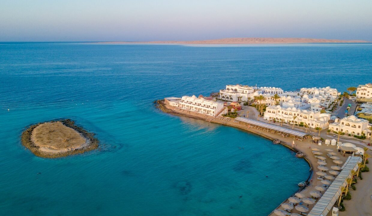 Aerial view of Hurghada coastline showcasing luxury resort buildings and turquoise waters.