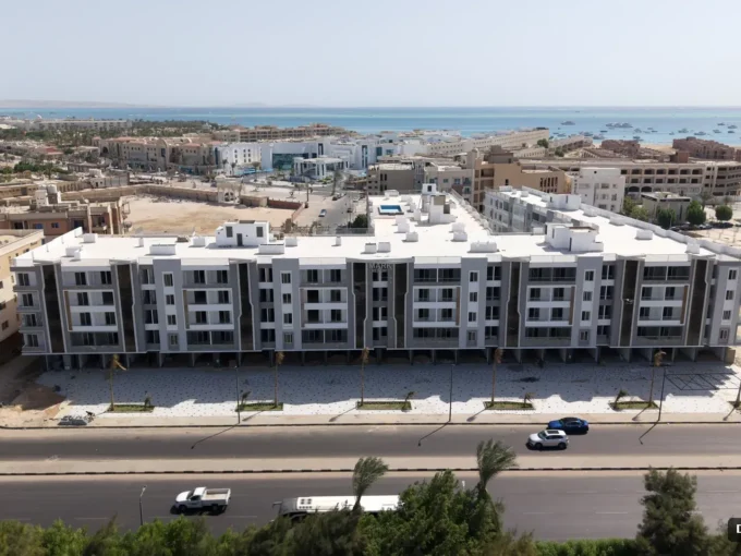 Aerial view of Mark Resort apartment buildings in Al Kawther, Hurghada, with the sea in the distance