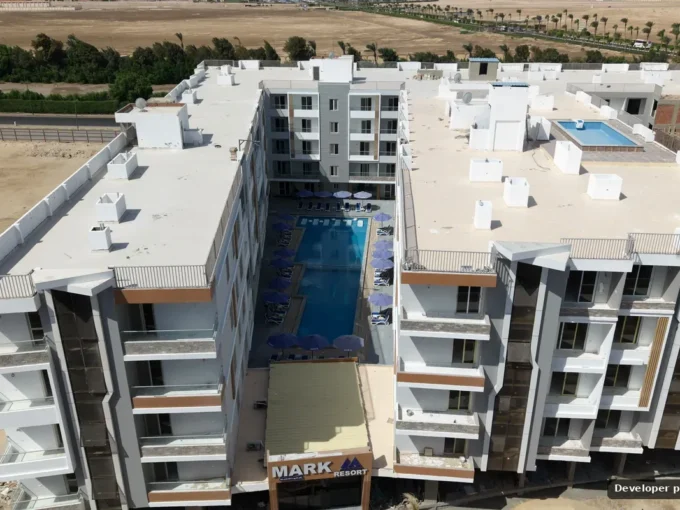 Aerial view of the courtyard pool between residential blocks at Mark Resort, Al Kawther, Hurghada