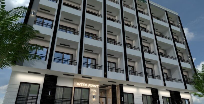 INTER POINT Hurghada — building 101 entrance with palm landscaping